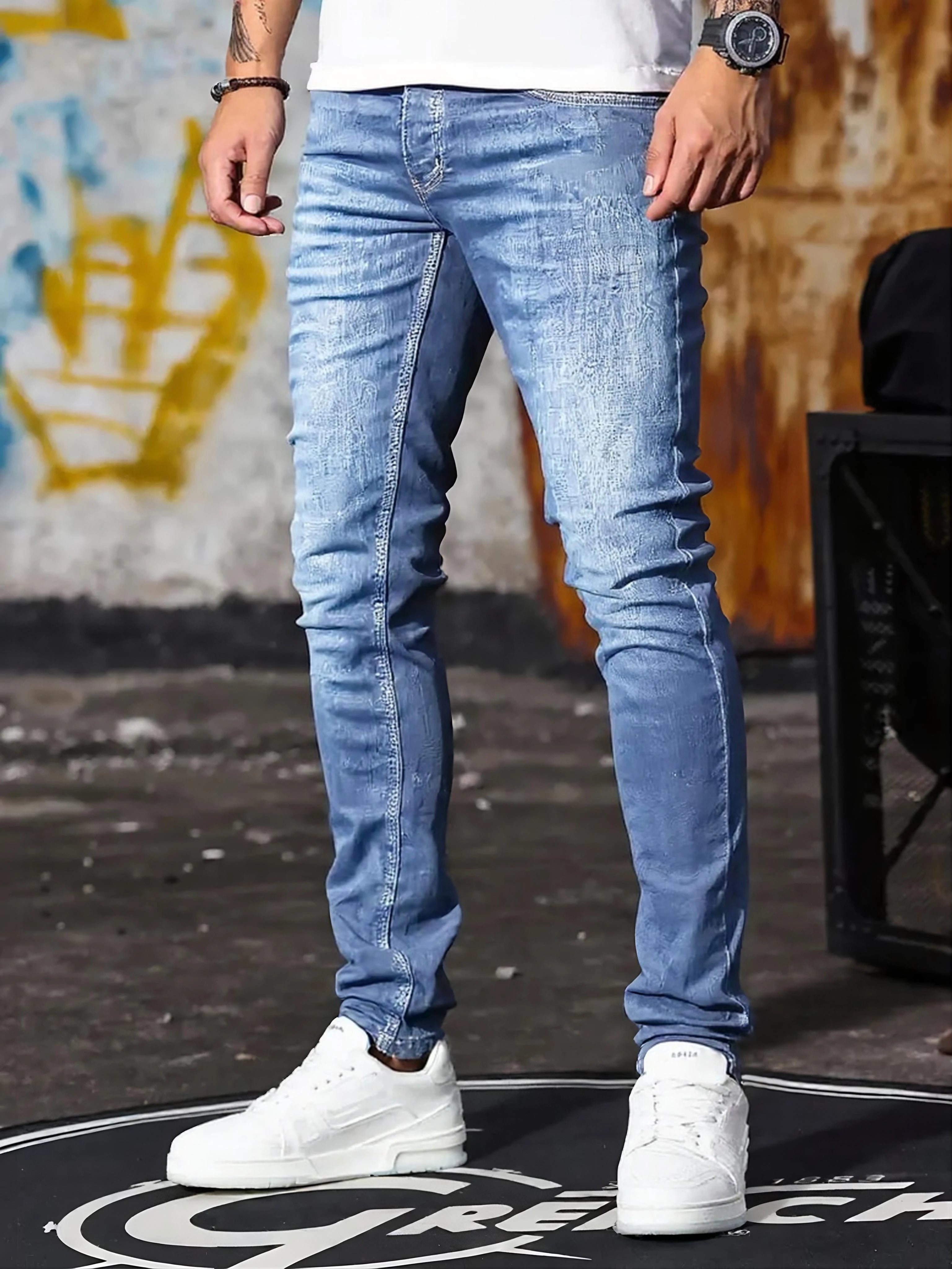 A set of three men's slim-fit jeans in multiple colors, including black, dark blue, and light blue, designed to fit the body sha