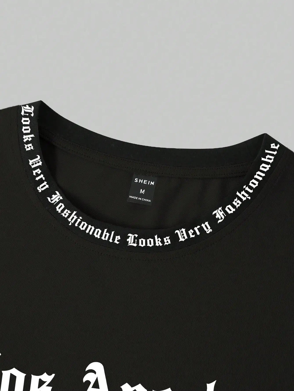 Black Oversized Graphic Print Crew Neck T-Shirt with Gothic Font Design