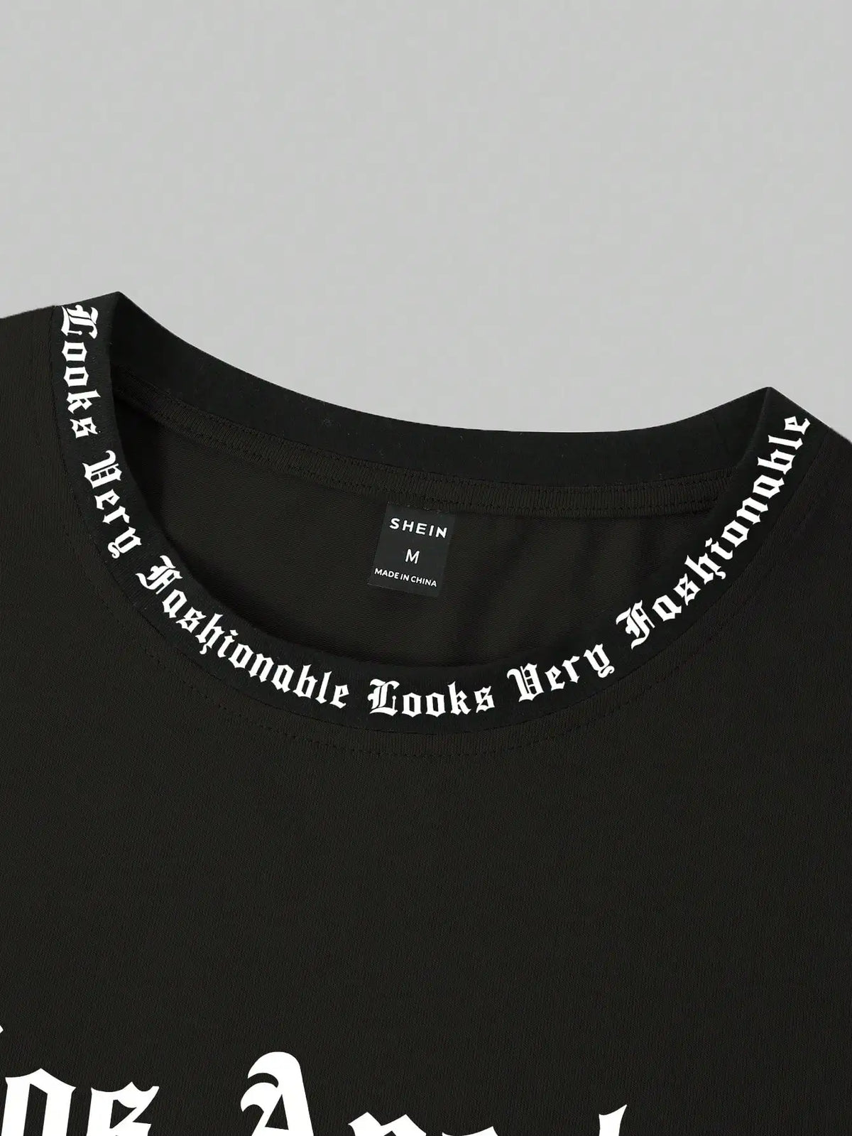 Black Oversized Graphic Print Crew Neck T-Shirt with Gothic Font Design